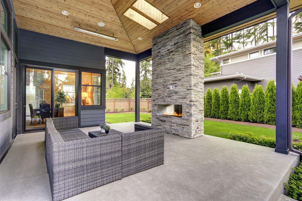 Image of a covered concrete patio addition to a home