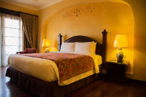 Image of a bedroom painted with a warm yellow color