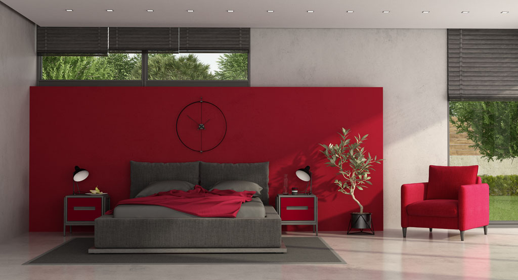 Image of a neutral bedroom with an accent wall painted red