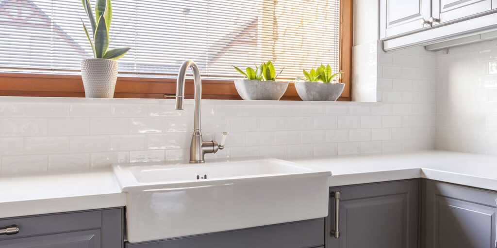 Kitchen sink with a gooseneck faucet