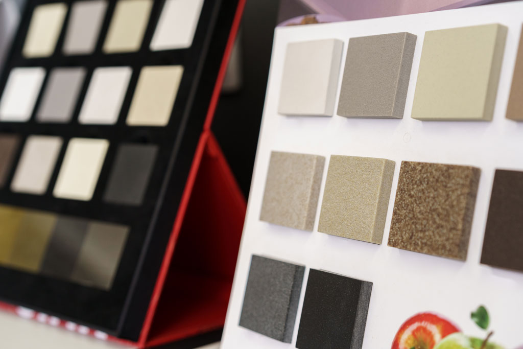 A swatch of various kitchen countertop material and colors